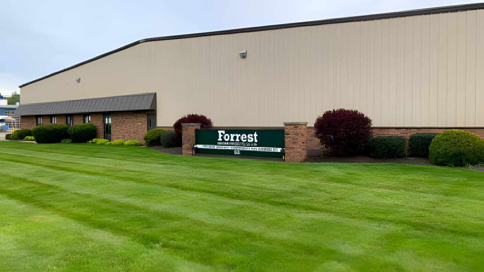 Forrest Machine Products facility exterior with company sign